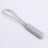 A silver zipper pull replacement clip with a white cord is shown against a white background.