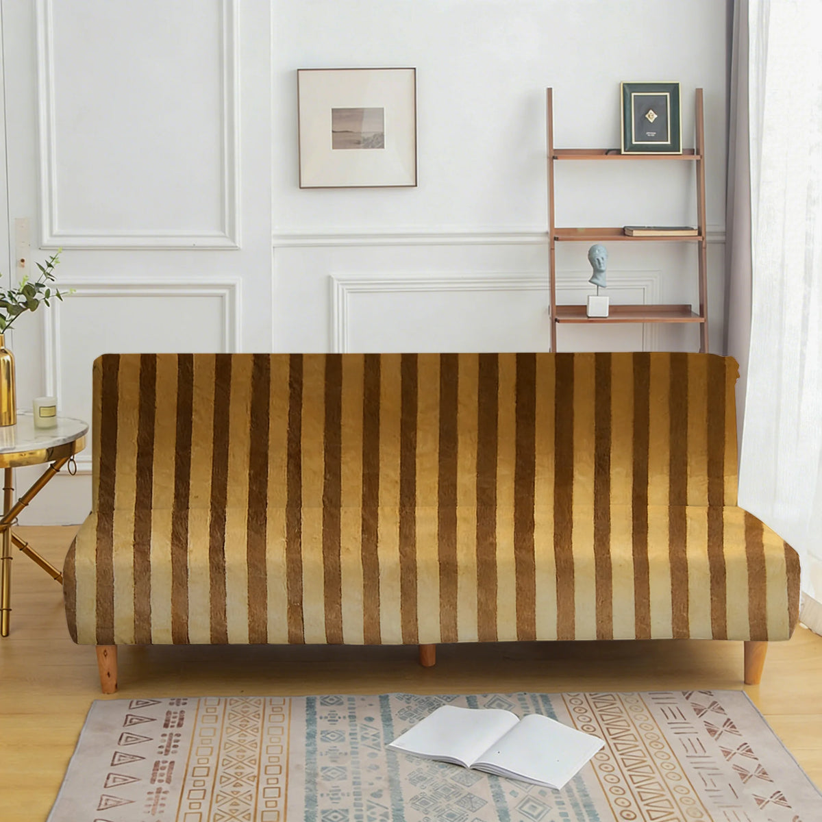 A brown striped velvet sofa cover displayed in a bright room with white wainscoting and wooden shelving.