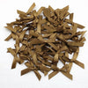 A pile of small, tan satin ribbon bows used for crafts and decor.