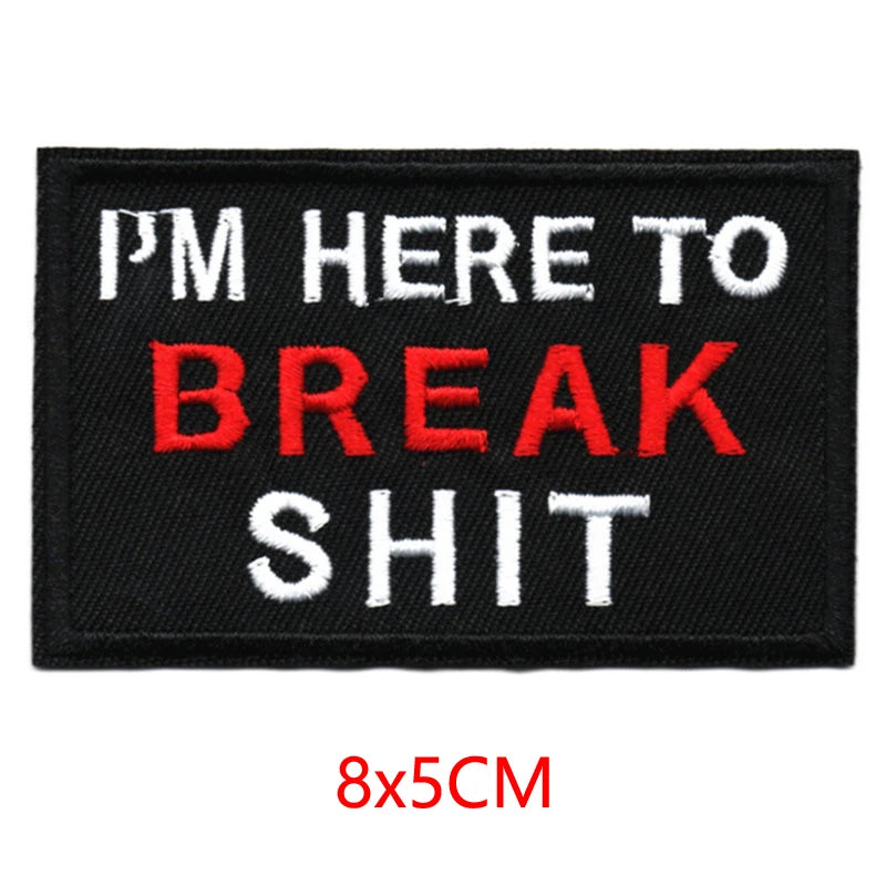 Black embroidered patch with white and red text that reads I'm here to break shit