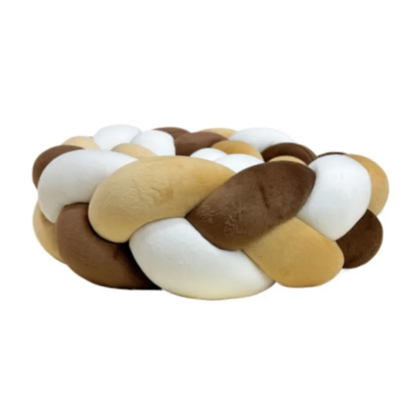 Handmade knotted floor mat for bed decor made of woven beige and brown fibers