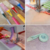 A set of professional sewing bias binder tools featuring various colored plastic pins and needles for fabric work.