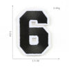 A black felt number six patch with white trim, measuring 3.5 cm by 5 cm and weighing 0.84g.