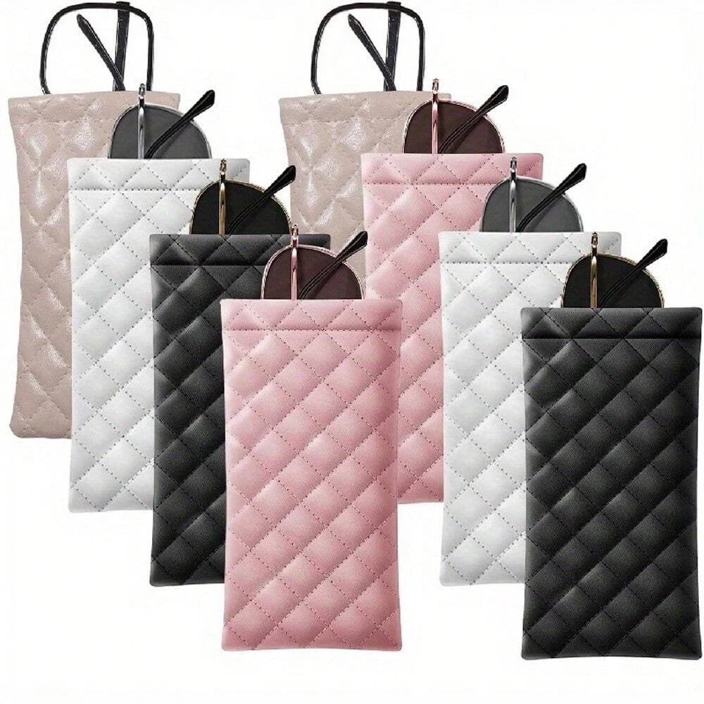 A collection of pink, gray, and black squeeze-top PU leather eyeglass cases with cleaning cloths.