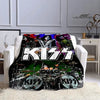 A black and white printed flannel travel blanket featuring the KISS band logo and imagery.