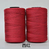 Two spools of red hand knitting and crochet cord for crafting