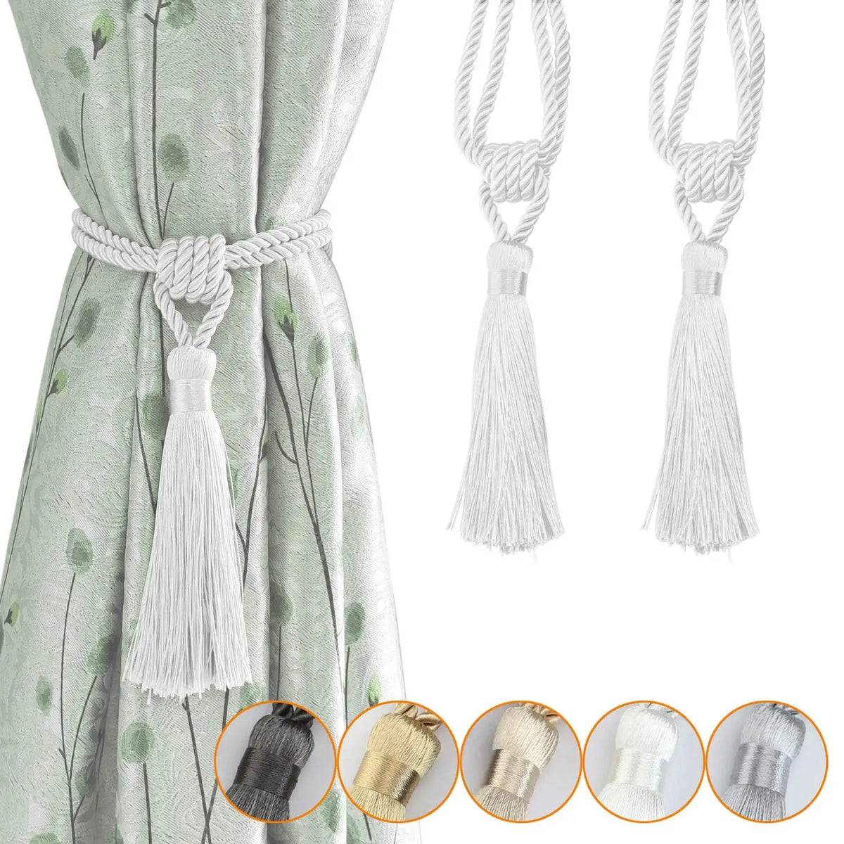 Elegant silver curtain tiebacks with white braided cord and tassels shown against a light green fabric.