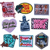 A collection of iron-on embroidered letter patches featuring various sayings and designs.