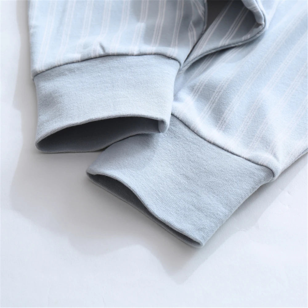 Light blue cotton striped sleeping bag for children shown folded