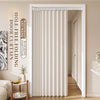 A floor-length beige folding curtain hanging in a white door frame.