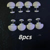 A set of eight white no-sew silicone quilt clips arranged in two rows.