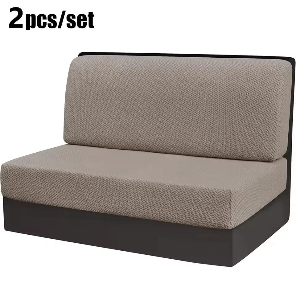 A pair of beige stretch jacquard seat covers for vehicle upholstery shown flat.