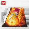 A vibrant illustration of Goku in a Super Saiyan transformation on a flannel throw blanket.