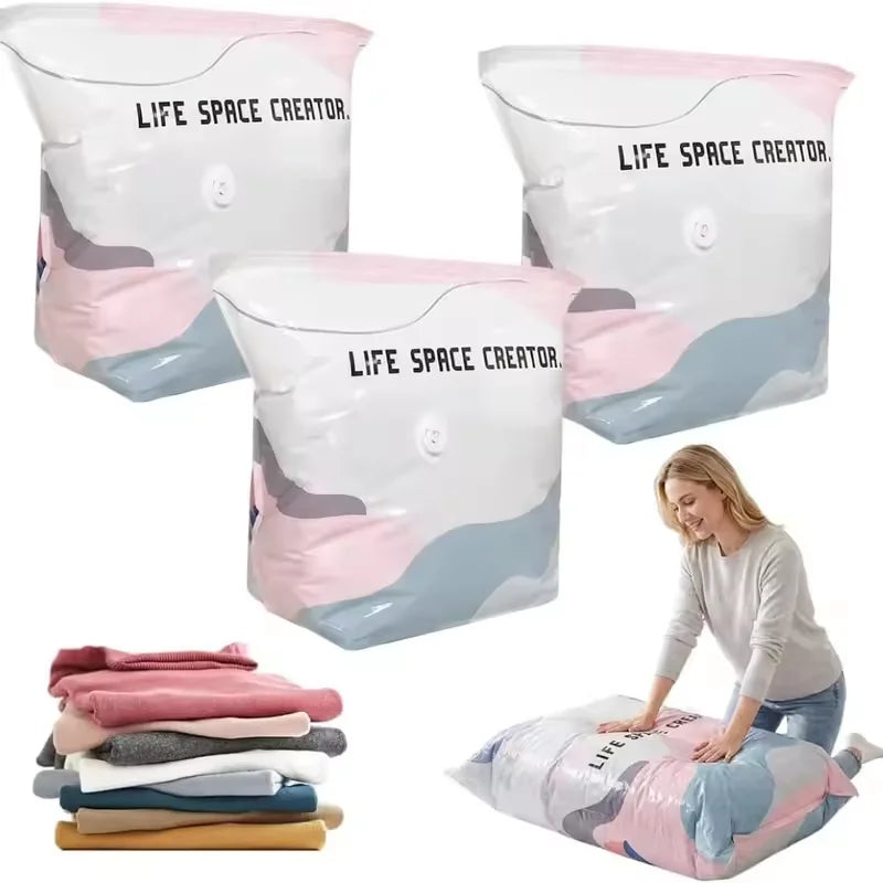 White and pink vacuum storage bags of various sizes shown next to folded clothing.