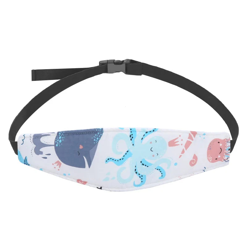 A white and blue patterned head support pillow with a black adjustable strap for a baby car seat.