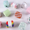 A collection of hand knitting yarn in various colors and textures, including solid and gradient pearl rainbow lace.