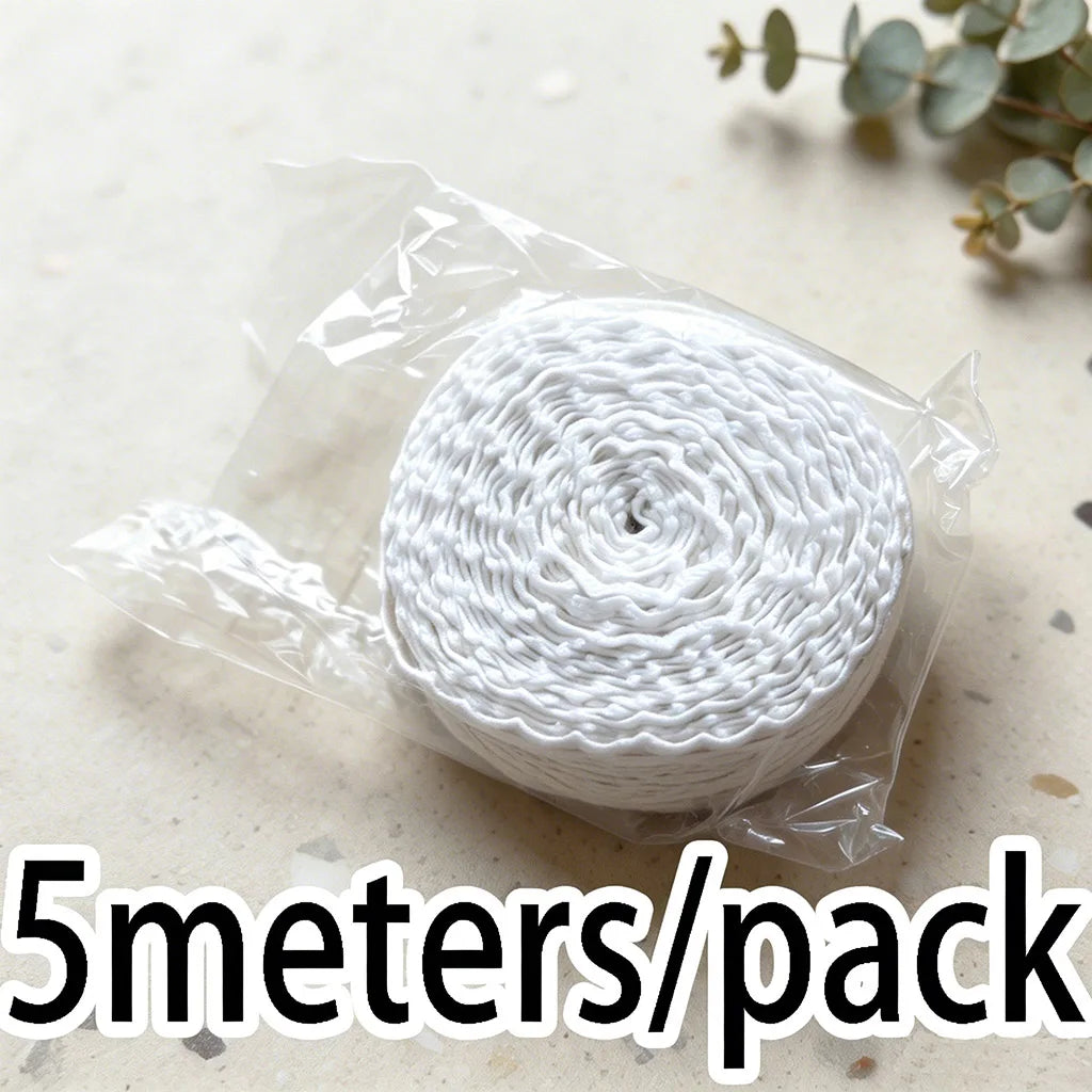 A roll of white cotton embroidered lace trim, 5 meters long, packaged in clear plastic.