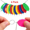 A pack of six colorful plastic needles or threaders arranged in a curved line.