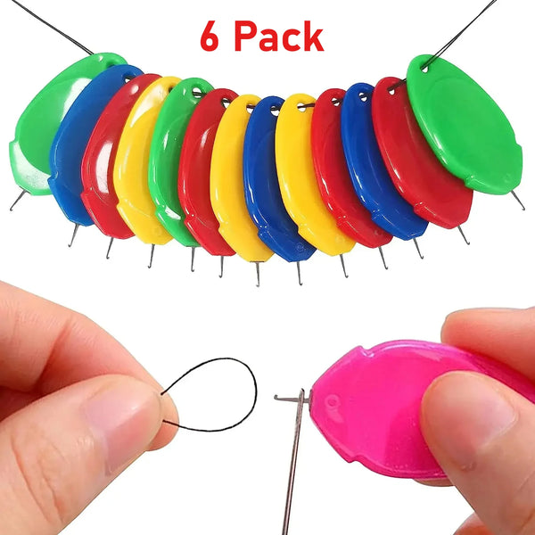 A pack of six colorful plastic needles or threaders arranged in a curved line.