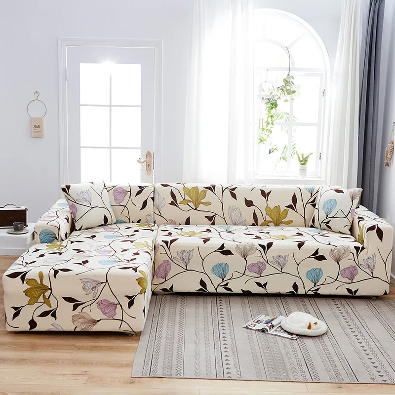 A beige sofa protector cover featuring a floral and leaf print on a light-colored fabric.