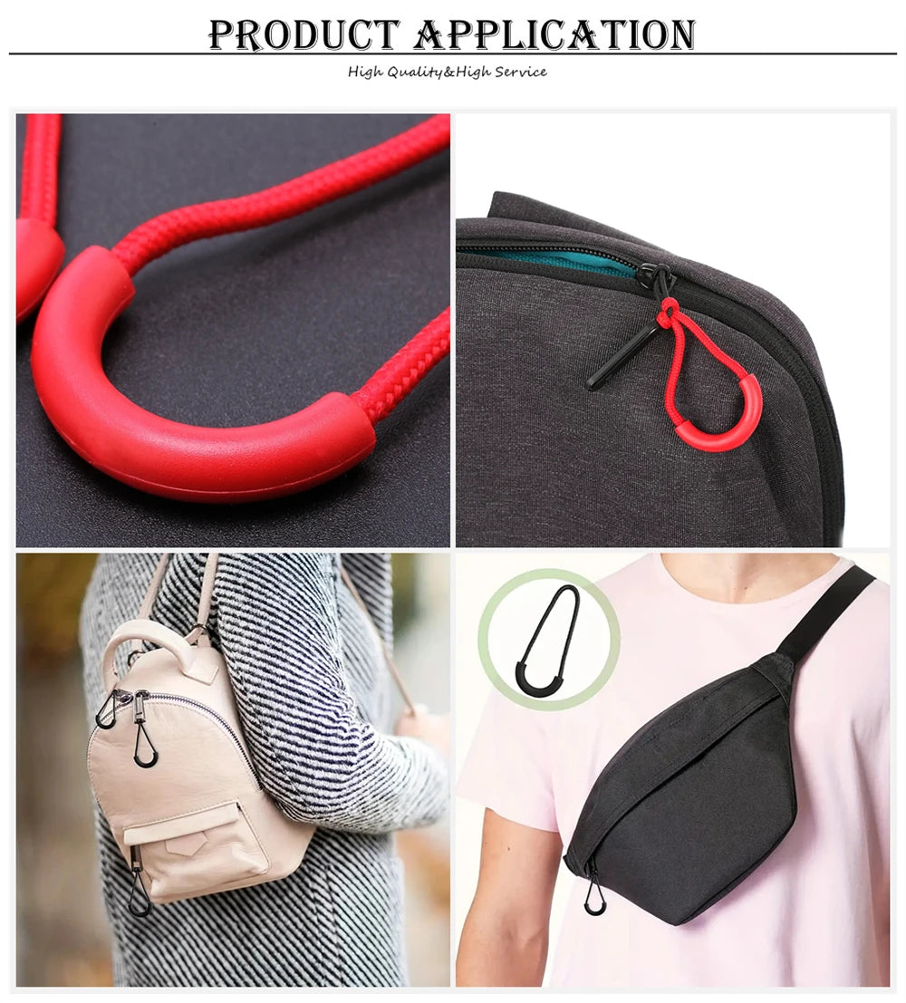 Red and black U-shape zipper pull straps shown in close-up against a dark background and attached to a gray fabric bag.