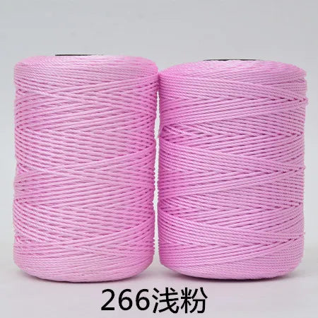 Spool of pink hand knitting and crochet cord for crafting