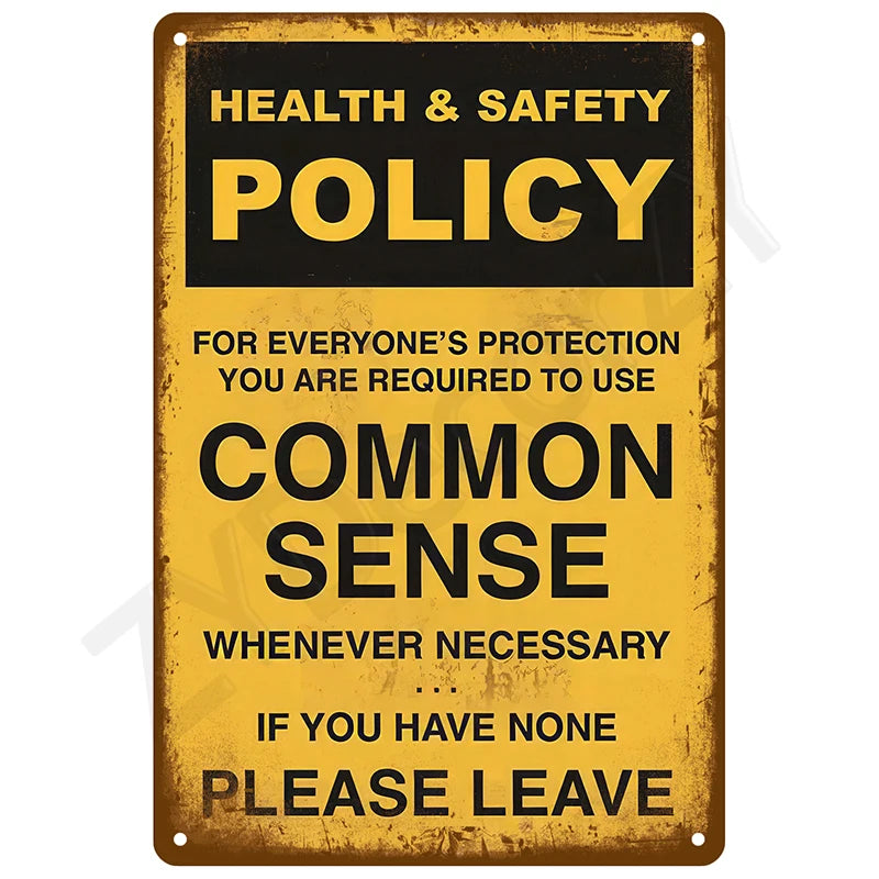 A vintage metal sign with yellow background and black text instructing to use common sense or leave.