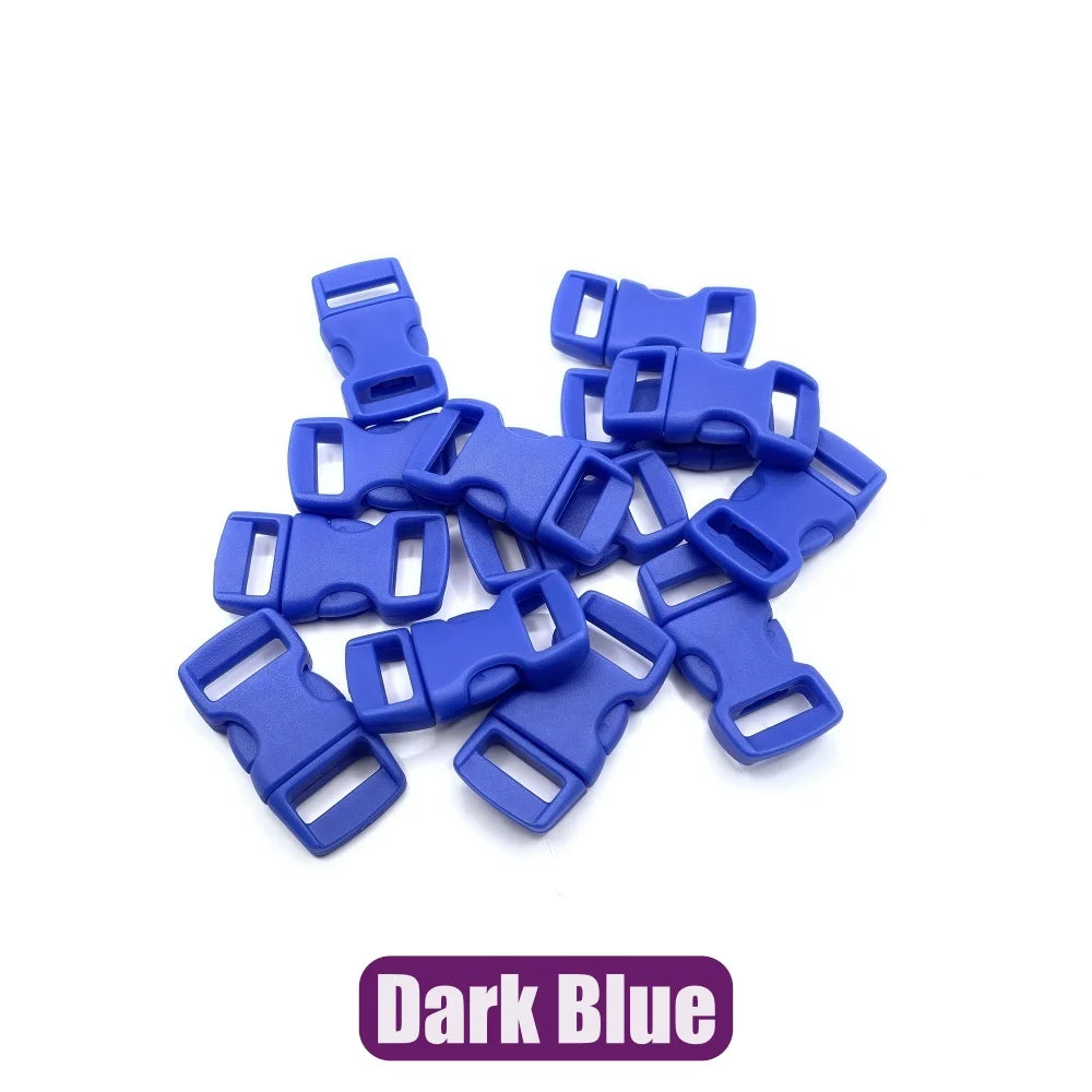 A pile of dark blue adjustable plastic paracord buckle bracelets.