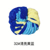 A ball of hand-woven chunky chenille yarn in shades of blue and yellow.