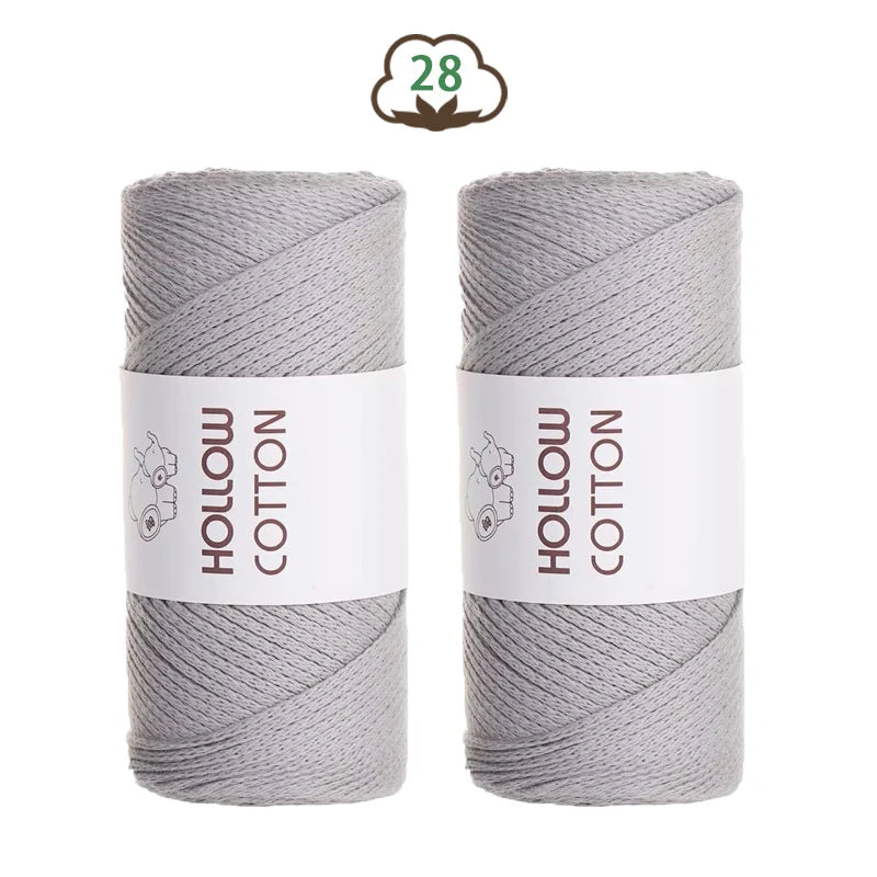 Two spools of gray hollow cotton yarn, labeled with the number 28.