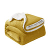 A golden yellow sherpa fleece blanket rolled up, showing its fluffy white trim.