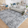 A gray plush long-pile area rug in a modern living room setting.