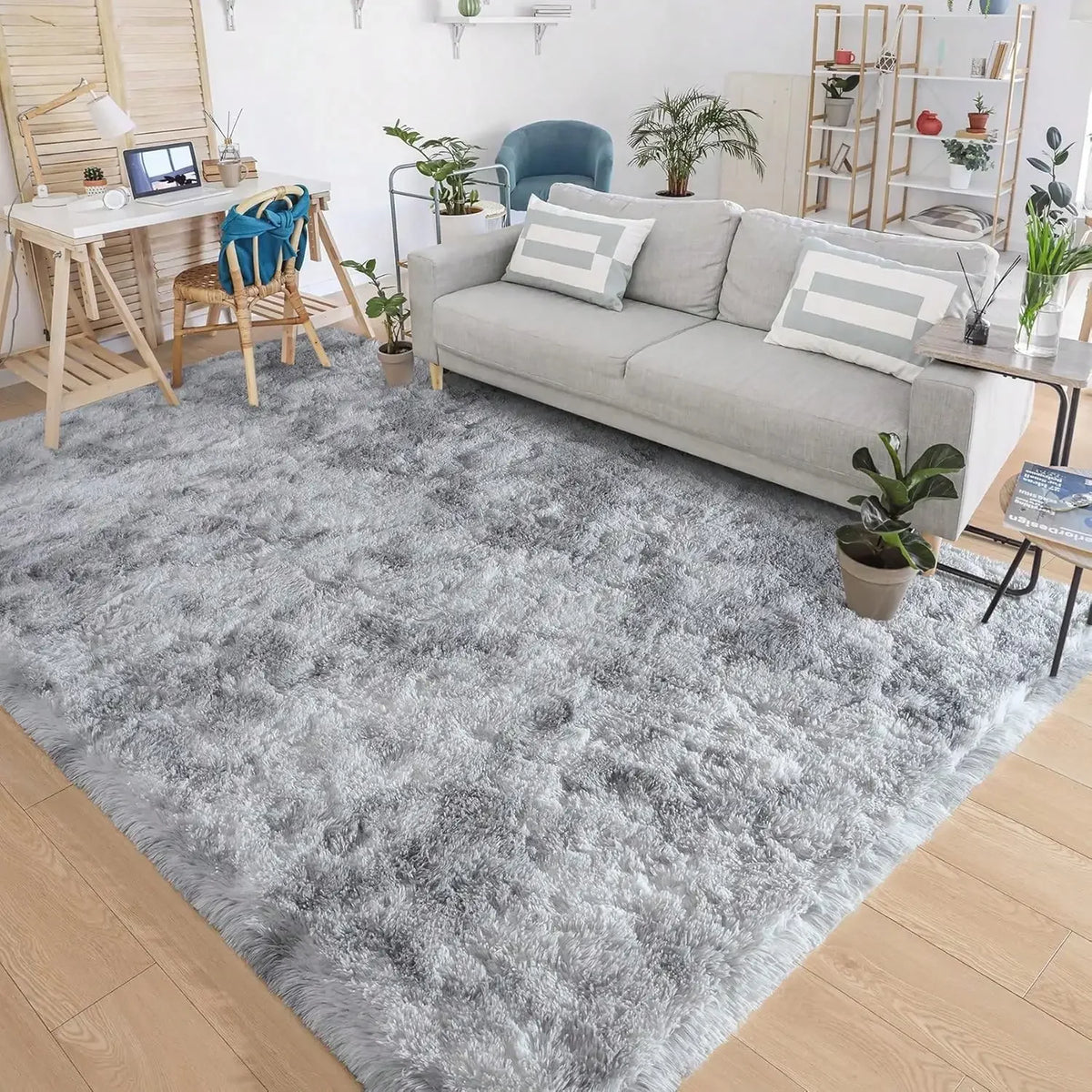 A gray plush long-pile area rug in a modern living room setting.