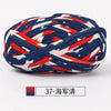 A ball of hand-dyed fabric strip yarn featuring a patriotic design with red, white, and blue stripes and stars.