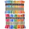 A set of gradient embroidery threads in various colors including pink, blue, green, yellow, and orange.