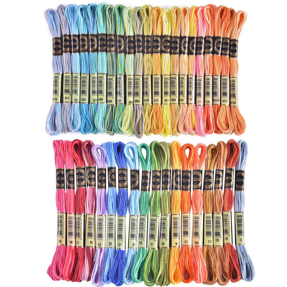 A set of gradient embroidery threads in various colors including pink, blue, green, yellow, and orange.