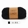 Black sweet candy yarns skein with a brown label and a color swatch labeled 06-black.