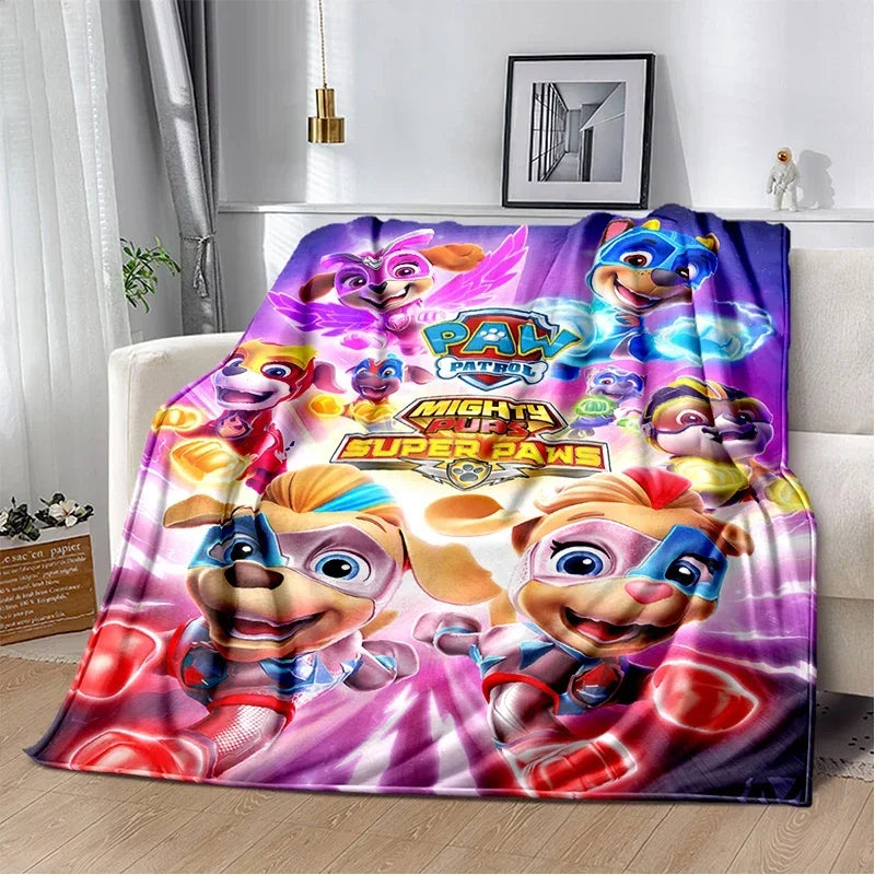A colorful flannel throw blanket featuring the Paw Patrol characters in various poses.
