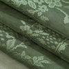 Close-up of olive green boho lace sheer curtains showing intricate floral patterns and texture.