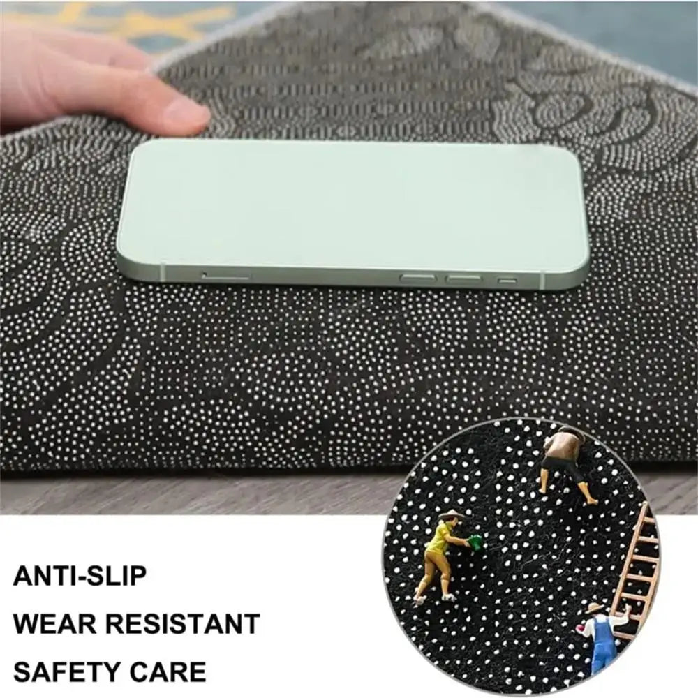 A light green rectangular silicone mat is placed on a dark patterned carpet, highlighting anti-slip and wear-resistant safety