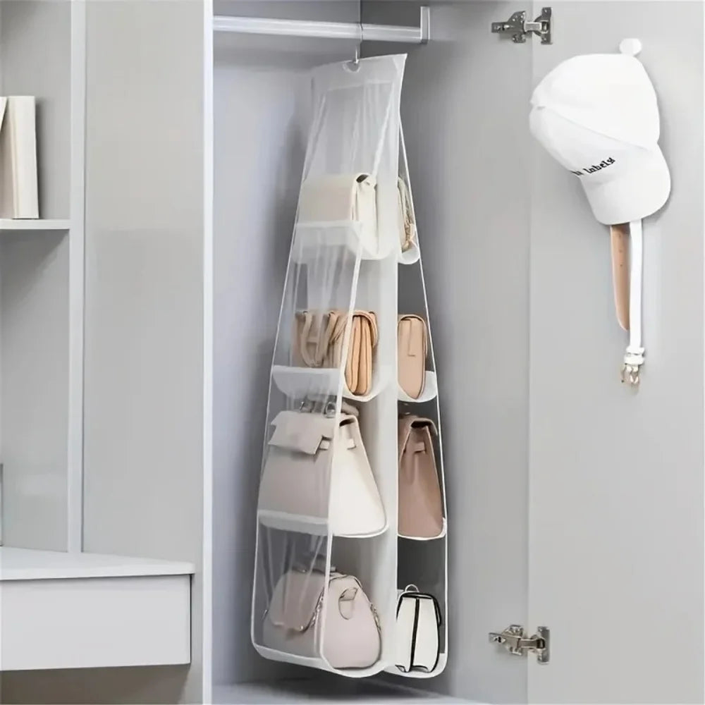 A double-sided hanging closet organizer bag with various light beige and pink bags displayed on a gray wall shelf.