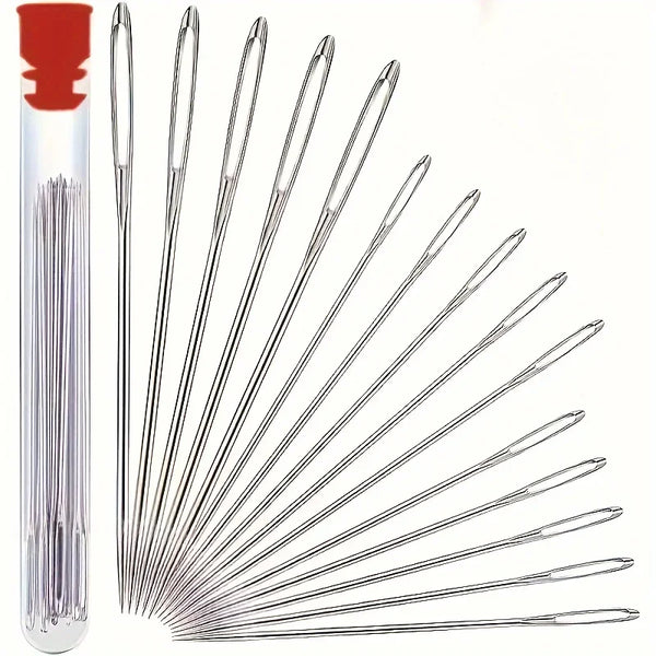 A set of silver sewing needles arranged radially inside a red storage box.