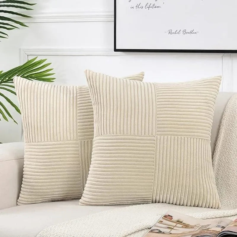 A set of beige retro corduroy patchwork pillow covers displayed on a white sofa.