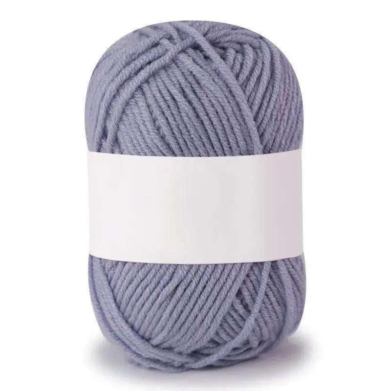 A ball of soft gray milk cotton knitting yarn