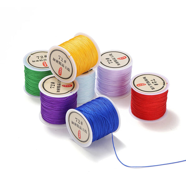 Rolls of nylon macrame cord in various colors including yellow, green, purple, blue, and red for jewelry making