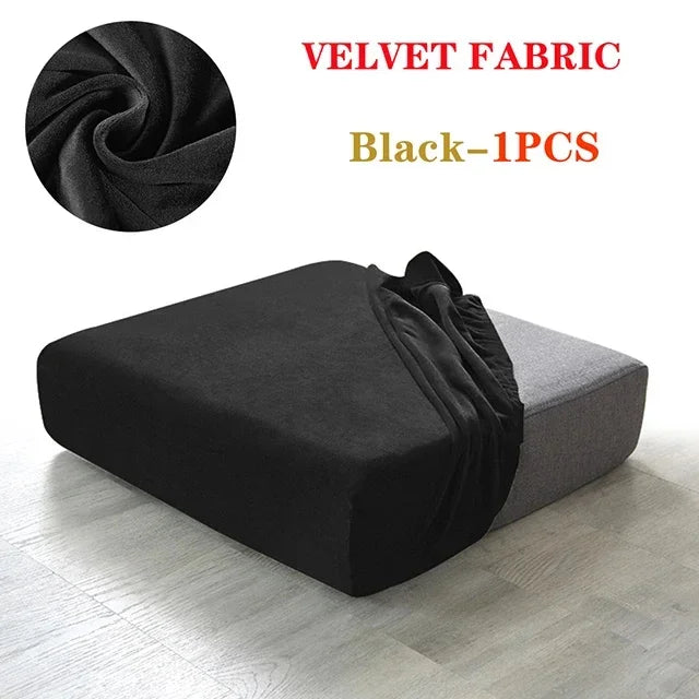 Black velvet fabric sofa seat covers shown in a draped style on a modern gray sofa.