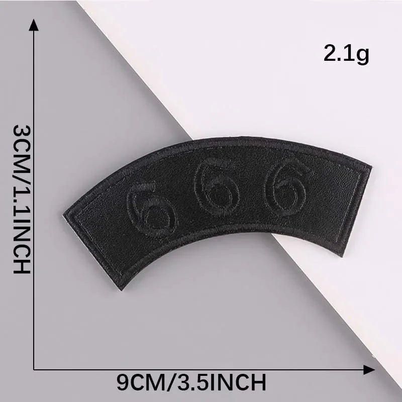 A black embroidered leather patch is shown against a gray background, measuring 9cm long and 3cm thick.