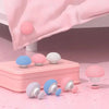 A pink duvet cover is draped with round pink clips and a set of non-slip clips in various shades of pink and blue.