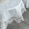White embroidered lace tablecloth with an elegant scalloped edge