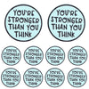 Two circular patches with embroidered text that read You're stronger than you think